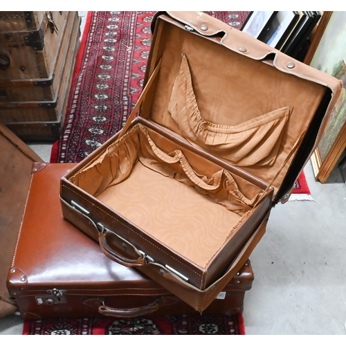 532 - Two vintage brown leather suitcases with canvas covers 