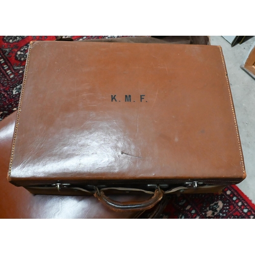 532 - Two vintage brown leather suitcases with canvas covers 