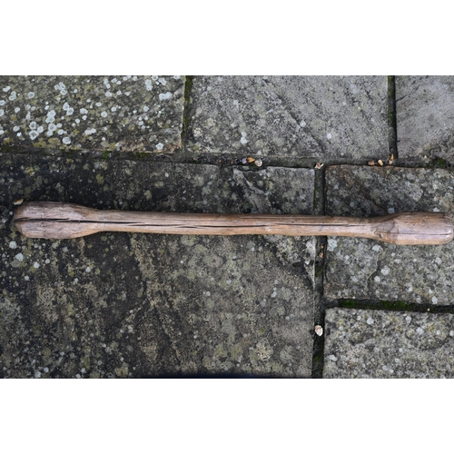 80 - An African trival carved club/grain pounder, 84 cm long