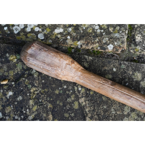 80 - An African trival carved club/grain pounder, 84 cm long