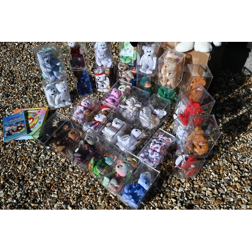 91 - A collection of over fifty Beanie Baby teddy bears - some boxed, to/w other related merchanise etc (... 