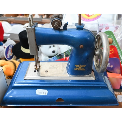 94 - Cassige (Germany-British Zone) toy sewing machine to/w St Michael toy shop-till and Petite toy typew... 