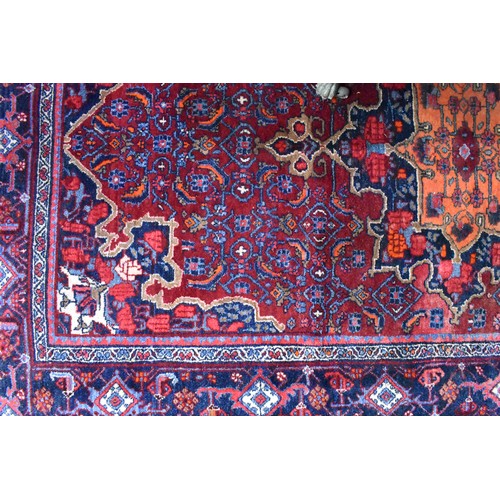 505 - A fine antique Persian hand-made Bidjar rug, the wine-red ground centred by a medallion, 274 cm x 15... 