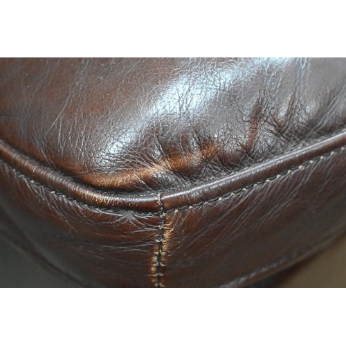 143 - A brown leather two seater sofa, 180 cm w x 95 cm d x 95 cm h, to/w a matching three seater sofa, 23... 