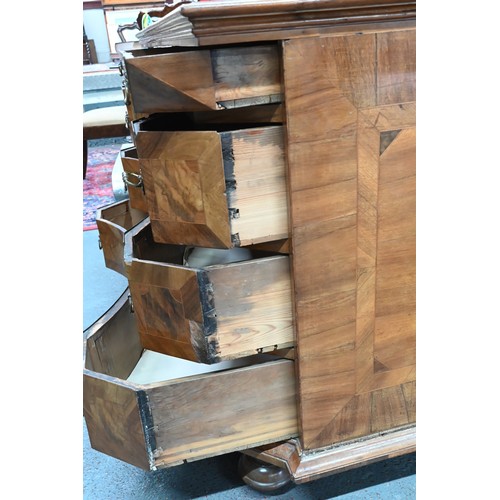 373 - An 18th century continental (South German) inlaid walnut commode, the full width frieze drawer over ... 