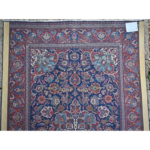 150 - A Persian Kashan rug, palmettes and rosettes arranged symmetrically around the large central floral ... 