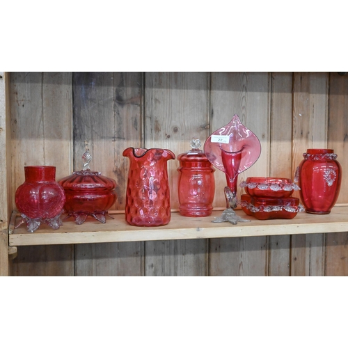 22 - Seven pieces of Victorian and later cranberry glass, including Art Nouveau style pitcher plant vase