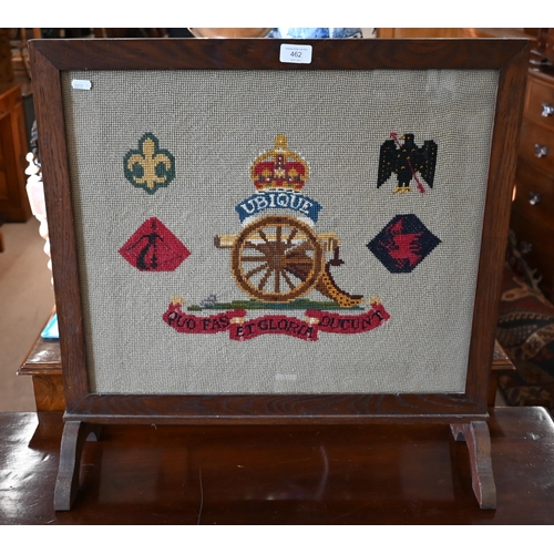 462 - An oak framed Royal Artillery fire screen with armorial tapestry panel (glazed) to/w three brass dou... 