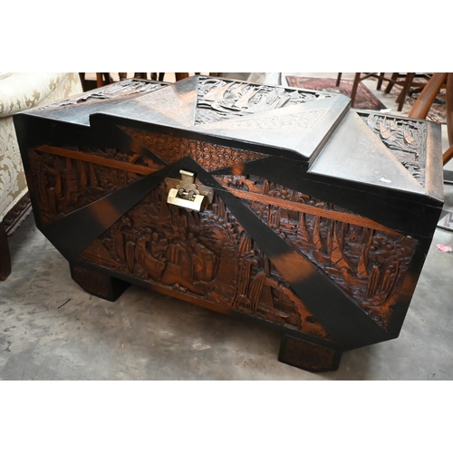 463 - A Chinese hardwood and camphor lined blanket chest extensively carved with figures and landscapes, b... 