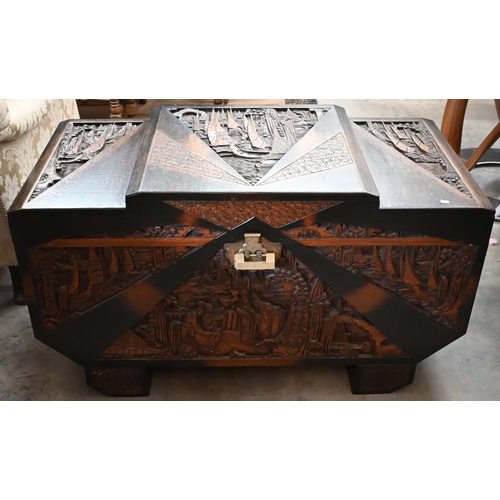 463 - A Chinese hardwood and camphor lined blanket chest extensively carved with figures and landscapes, b... 