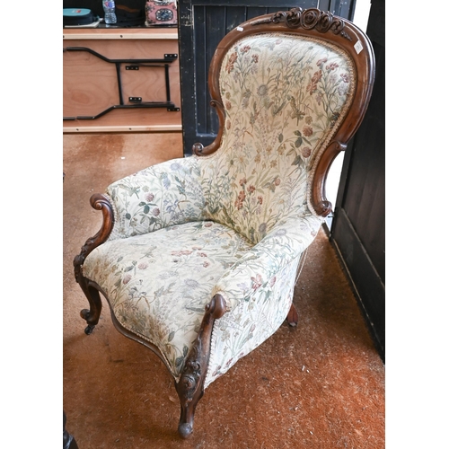 475 - A Victorian mahogany armchair with floral upholstery