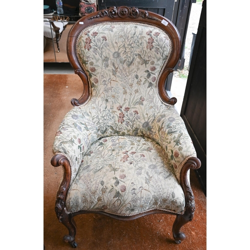 475 - A Victorian mahogany armchair with floral upholstery