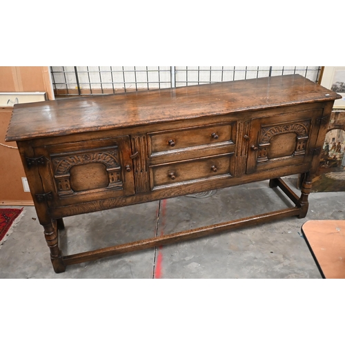 481 - An Ipswich quality carved oak sideboard in the 17th century style with two central drawers flanked b... 