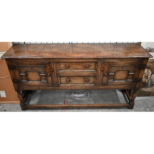 481 - An Ipswich quality carved oak sideboard in the 17th century style with two central drawers flanked b... 