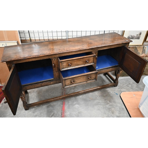 481 - An Ipswich quality carved oak sideboard in the 17th century style with two central drawers flanked b... 