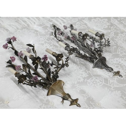 482 - A matched pair of floral and foliate cast three branch metal sconces with ceramic flowers, 75 cm