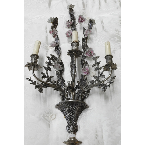 482 - A matched pair of floral and foliate cast three branch metal sconces with ceramic flowers, 75 cm