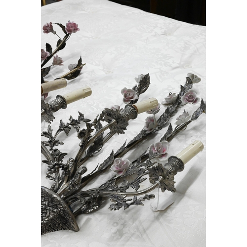 482 - A matched pair of floral and foliate cast three branch metal sconces with ceramic flowers, 75 cm