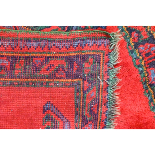 483 - A vintage Turkish red ground runner with geometric design and repeating boteh border, 415 x 82 cm