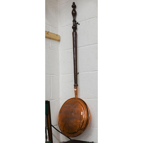 485 - #An antique engraved copper warming pan with turned mahogany handle