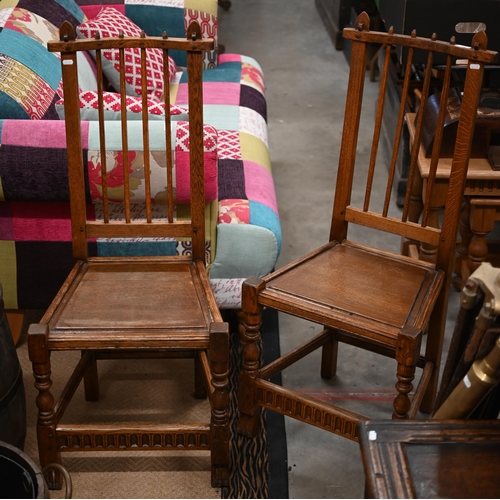 487 - A pair of 17th century style provincial jointed oak side chairs with panelled seats and turned legs