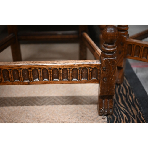 487 - A pair of 17th century style provincial jointed oak side chairs with panelled seats and turned legs