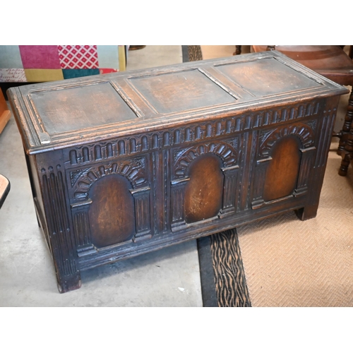 488 - A dark oak blanket chest or coffer, of panelled construction with arcade carved facade, 117 cm wide ... 