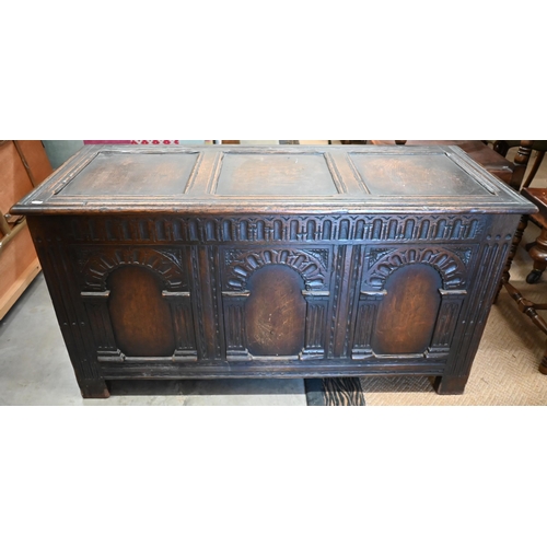 488 - A dark oak blanket chest or coffer, of panelled construction with arcade carved facade, 117 cm wide ... 