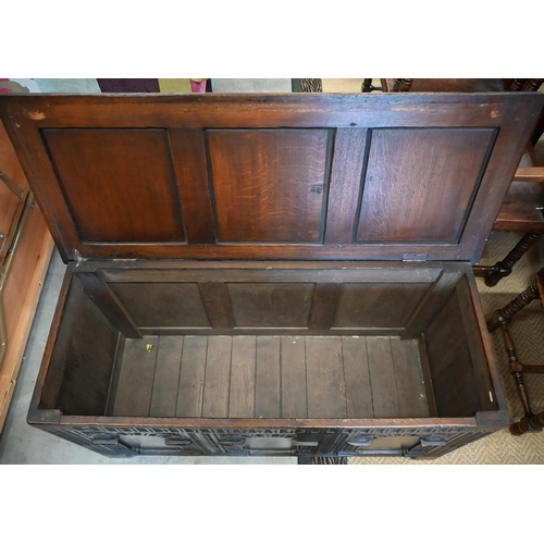 488 - A dark oak blanket chest or coffer, of panelled construction with arcade carved facade, 117 cm wide ... 