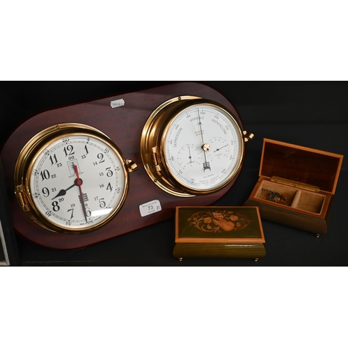 73 - Marine clock and aneroid barometer in brass drum cases, mounted on teak plaque, 45 cm wide overall t... 