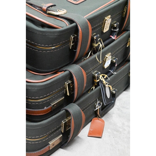 75 - A graduated set of three Antler suitcases, to/w a similar carry-on case (4)