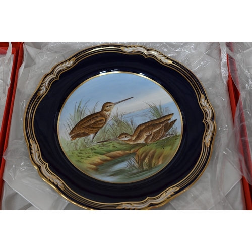 49 - Set of five boxed Spode cabinet plates, painted with birds, within blue and gilt borders, 23.5 cm di... 
