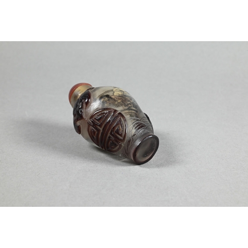 409 - A Chinese Peking cameo glass ovoid snuff bottle with red stopper, the clear glass bottle inside pain... 