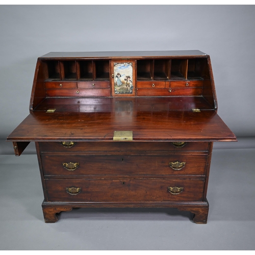 862 - A George III mahogany bureau, the fitted interior centred by a polychrome painted cupboard door over... 