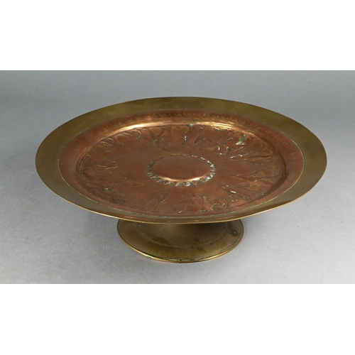 1238 - A 19th century French bronze and copper tazza in the Etruscan manner, embossed with figures going to... 