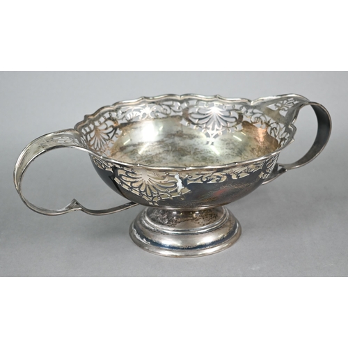 102 - Silver bowl with Art Nouveau-style piercing and twin scroll handles, on raised moulded foot, Walker ... 