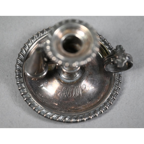 141 - George IV silver chamber taper-stick with gadrooned rims and shell-mounted ring handle, c/w original... 