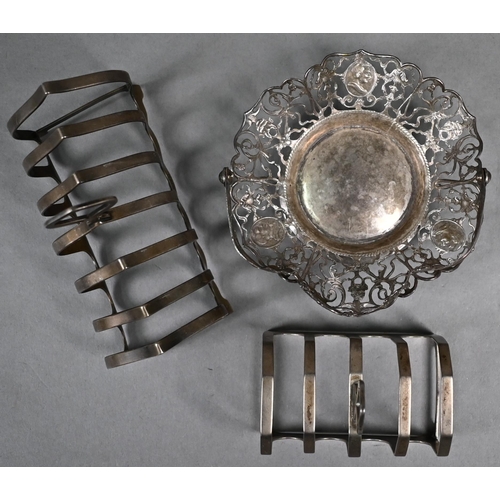 155 - Silver six-division toast-rack and a four-division example, to/w a Dutch pierced bonbon basket with ... 