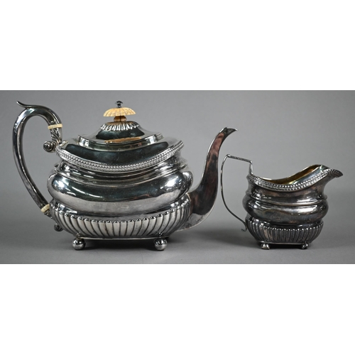 157 - Regency silver teapot of oblong form with half-reeding and guilloche band, ivory finial and insulato... 