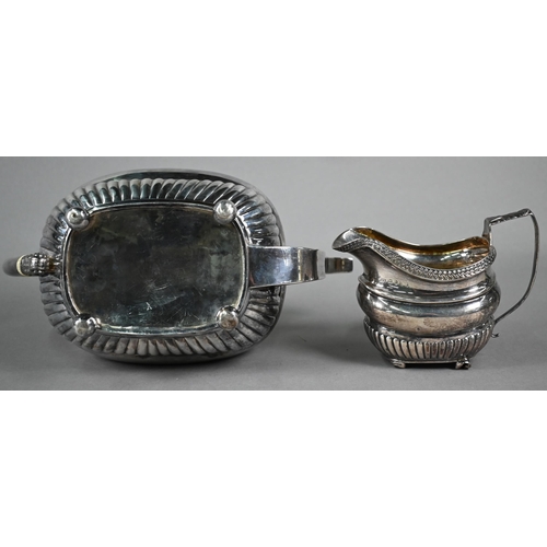 157 - Regency silver teapot of oblong form with half-reeding and guilloche band, ivory finial and insulato... 