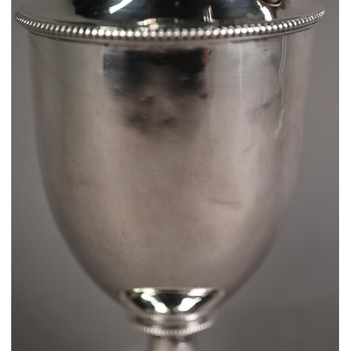 165 - Unmarked white metal baluster hot water jug with hinged cover and stemmed foot, with beaded rims; th... 