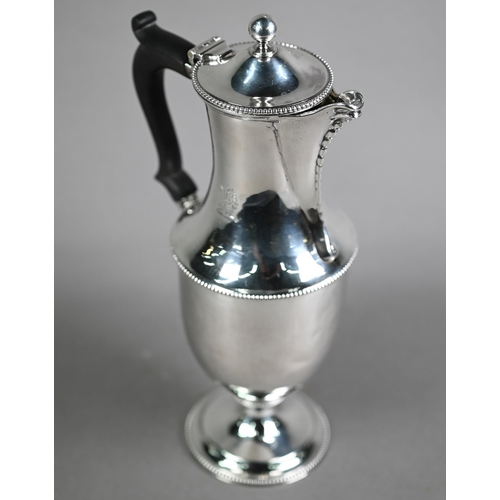 165 - Unmarked white metal baluster hot water jug with hinged cover and stemmed foot, with beaded rims; th... 