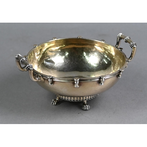 166 - Arts & Crafts planished silver gilt bowl with twin handles, on four claw feet, Wakeley & Whe... 