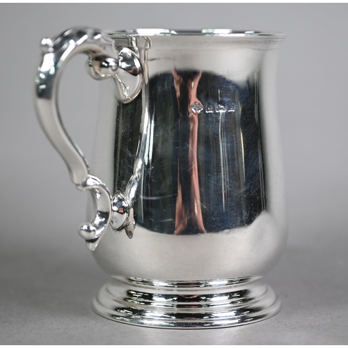 167 - Silver baluster half-pint mug in the Georgian manner, with scroll handle and moulded foot-rim, Willi... 