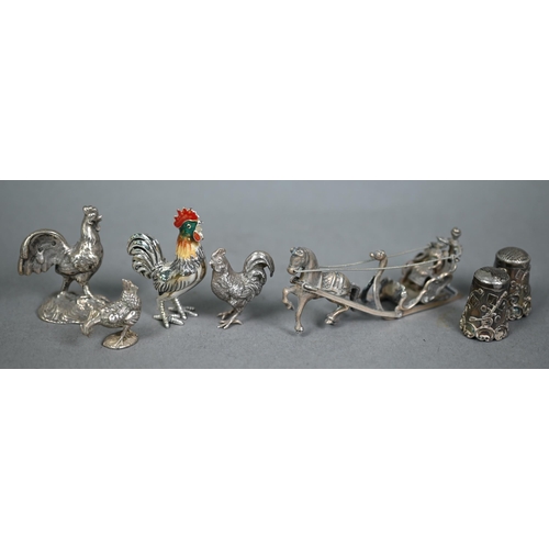 185 - Three miniature silver chickens - one with enamelled head - to/w a white metal example (mark not ide... 