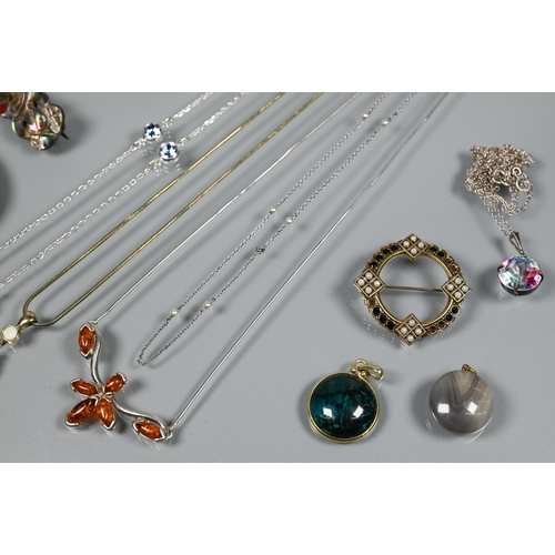 211 - A small collection of costume jewellery including round pendant set possibly tourmaline, mother of p... 