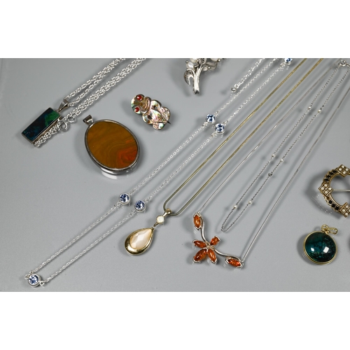 211 - A small collection of costume jewellery including round pendant set possibly tourmaline, mother of p... 