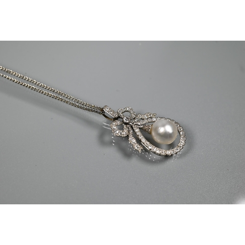 213 - A Belle Epoque diamond and pearl pendant, the old cut diamond-set bow above a tear-shaped diamond se... 