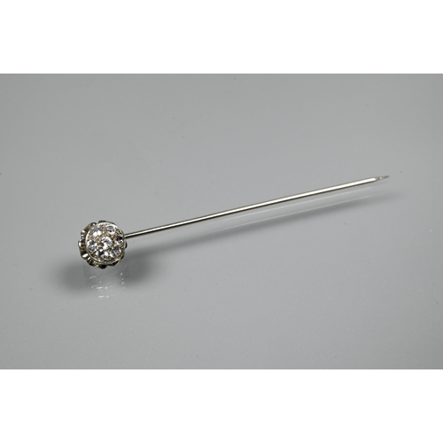 220 - A white metal stick pin set with six white spinel as a cluster, 5.5 cm long