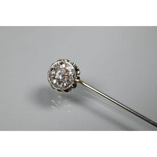 220 - A white metal stick pin set with six white spinel as a cluster, 5.5 cm long